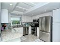 Modern kitchen with stainless steel appliances and granite countertops at 1215 S Portofino Dr # 308, Sarasota, FL 34242