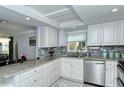 Modern kitchen with granite counters and stainless steel appliances at 1215 S Portofino Dr # 308, Sarasota, FL 34242