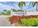 Crestwood Villas entrance sign with landscaping at 5372 Pamela Wood Way # 7, Sarasota, FL 34233
