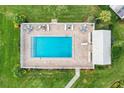 Community pool with surrounding patio furniture at 5372 Pamela Wood Way # 7, Sarasota, FL 34233