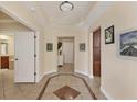 Elegant entryway with tile flooring and access to other rooms at 6360 Watercrest Way # 301, Bradenton, FL 34202