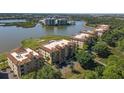 Aerial view of condo community by the lake and golf course at 6360 Watercrest Way # 301, Bradenton, FL 34202
