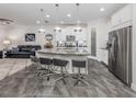 Open concept kitchen with island and stainless steel appliances at 8624 Rain Song Rd, Sarasota, FL 34238