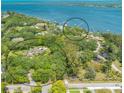 Aerial view showcasing the home's waterfront location and surrounding landscape at 7012 Riverview Blvd, Bradenton, FL 34209