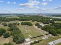 Aerial view of property with home and large lot at 18050 State Road 62, Parrish, FL 34219