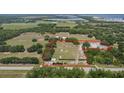 Aerial view of property with home and large lot at 18050 State Road 62, Parrish, FL 34219