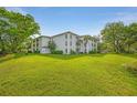 A beautiful condominium community surrounded by lush greenery, providing a serene and picturesque living environment at 6304 Pointe West Blvd # A102, Bradenton, FL 34209