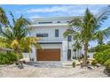 Modern two-story home with attached garage at 111 Gull Dr, Anna Maria, FL 34216