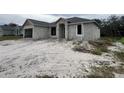 Newly constructed home with a block exterior and a spacious yard at 8233 Givlic Ln, North Port, FL 34287