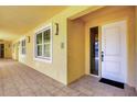 Condo entrance with secure front door, natural light, and clearly marked unit number at 280 Hidden Bay Dr # 302, Osprey, FL 34229