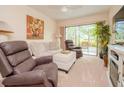 Living room with recliner, sofa, and fireplace at 748 White Pine Tree Rd # 104, Venice, FL 34285