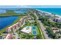 Aerial view of community near beach and waterways at 4900 Gulf Of Mexico Dr # 204, Longboat Key, FL 34228