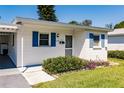 Quaint single story home with blue shutters and carport at 6029 Lilli Way # 6029, Bradenton, FL 34207