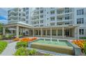 Elegant condo building entrance with fountain at 2450 Harbourside Dr # 212, Longboat Key, FL 34228