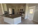 Modern kitchen featuring granite countertops and stainless steel appliances at 2593 Englewood Rd, Venice, FL 34293