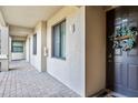 Condo building entryway with welcoming wreath and tile floor at 16804 Vardon Ter # 104, Bradenton, FL 34211