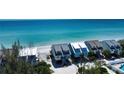 Beachfront community with colorful houses and a shared pool at 301 S Gulf Blvd # 20, Placida, FL 33946