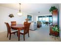 Bright dining room with a wood table, chairs, and access to other rooms at 3780 Pinebrook Cir # 504, Bradenton, FL 34209