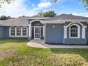 Home's front entrance featuring a screened porch at 4247 La Rosa Ave, North Port, FL 34286