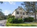 Two-story townhome with shutters, walkway, and landscaping at 5654 Simonton St, Bradenton, FL 34203