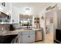 Updated kitchen featuring granite countertops, stainless steel appliances and charming nautical decor at 4410 Fairways Blvd # 406, Bradenton, FL 34209