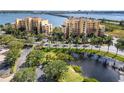 Beautiful aerial view of condo buildings, lush landscaping and water features at 611 Riviera Dunes Way # 108, Palmetto, FL 34221