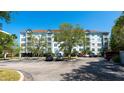 Three-story building with parking and lush landscaping at 210 3Rd W St # 8407, Bradenton, FL 34205