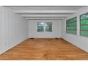 Empty spare bedroom with hardwood floors and large windows at 2439 Loma Linda St, Sarasota, FL 34239