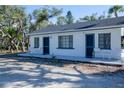 Charming beachfront cottage with a spacious patio and lush landscaping at 7730 Manasota Key Rd, Englewood, FL 34223