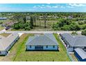 Aerial view showcasing a single-Gathering home's backyard at 8380 Malcolm Ave, North Port, FL 34287