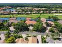 Luxury home with tile roof nestled in a golf course community at 10402 Riverbank Ter, Bradenton, FL 34212