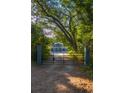Private gated entrance leading to a charming two story home at 655 N Clermont Rd, Venice, FL 34292