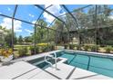 Beautiful screened-in pool with a spa, perfect for relaxation and entertainment at 7249 Orchid Island Pl, Bradenton, FL 34202