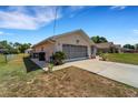 Single-story house with garage and a neatly landscaped yard at 4268 Mulgrave Ave, North Port, FL 34287