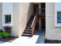 Condo building exterior with stairs and individual unit entrances at 2721 Hidden Lake Blvd # A, Sarasota, FL 34237