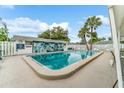 Refreshing community pool with a tiled deck at 6038 Lilli Way # 6038, Bradenton, FL 34207