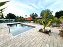 Inviting pool area with a spacious patio and lush landscaping at 2760 Chipley Ave, North Port, FL 34286