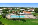 Large community pool with plenty of lounge chairs at 4364 Madeira Ct # 3355, Sarasota, FL 34233