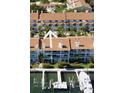 View of the condos at The Palms of Tierra with balconies and personal boat slips at 324 Madeira Cir, Tierra Verde, FL 33715