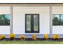 Modern front door entrance with landscaping at 4549 Targee Ave, North Port, FL 34287