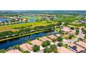 Aerial view of home on the lake at 502 Grand Preserve Cv, Bradenton, FL 34212