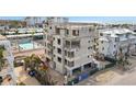 Aerial view of a building under construction near a pool and other buildings at 1150 Windsong Ln # 300, Sarasota, FL 34242