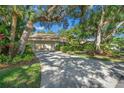 Beautiful home exterior with lush landscaping at 4560 Forest Wood Trl # 16, Sarasota, FL 34241