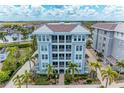 Exterior view of building with parking at 379 Aruba Cir # 202, Bradenton, FL 34209