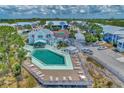Community pool with plenty of lounge chairs for relaxing at 6800 Placida Rd # 281, Englewood, FL 34224