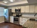 Bright kitchen featuring stainless steel appliances and granite counters at 2320 Terra Ceia Bay Blvd # 203, Palmetto, FL 34221