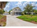 Charming two-story home with inviting front porch, detached garage and landscaped yard at 1810 28Th W St, Bradenton, FL 34205