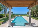 Inviting rectangular pool with pergola and breathtaking waterfront view at 4521 Bay Shore Rd, Sarasota, FL 34234