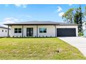Modern two-bedroom house with a two-car garage at 4593 Targee Ave, North Port, FL 34287
