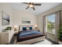 Spacious bedroom with a comfortable bed and plenty of natural light at 14939 Amberjack Ter # 102, Lakewood Ranch, FL 34202